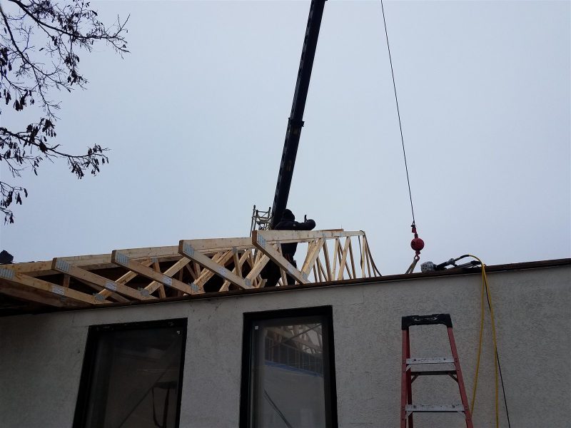 Commercial roof trusses being installed by Wheeler Construction